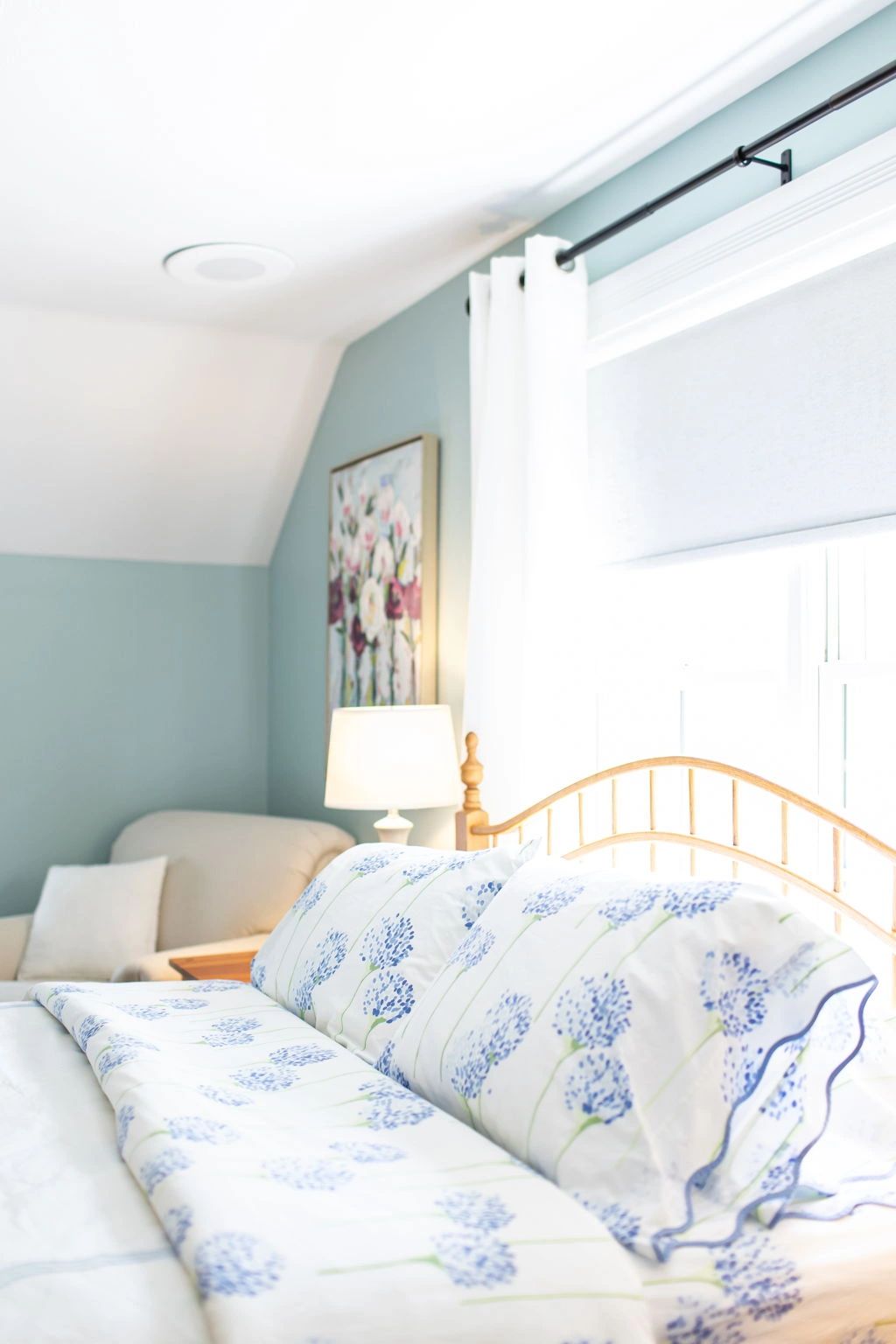 Bright bedroom with blue floral bedding