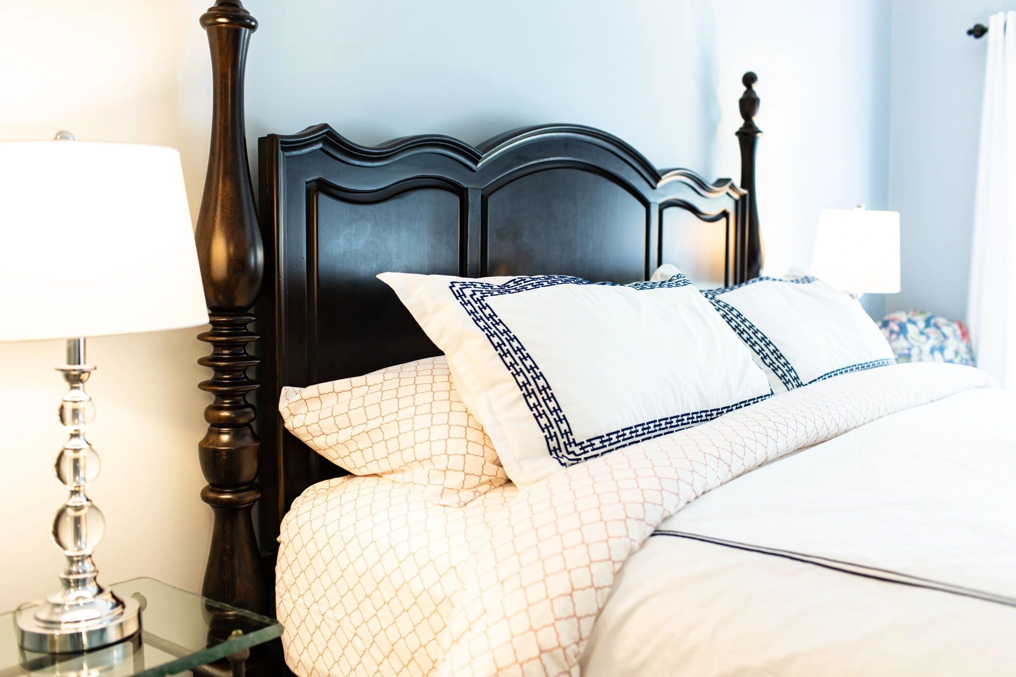 Elegant bedroom with ornate black bed frame